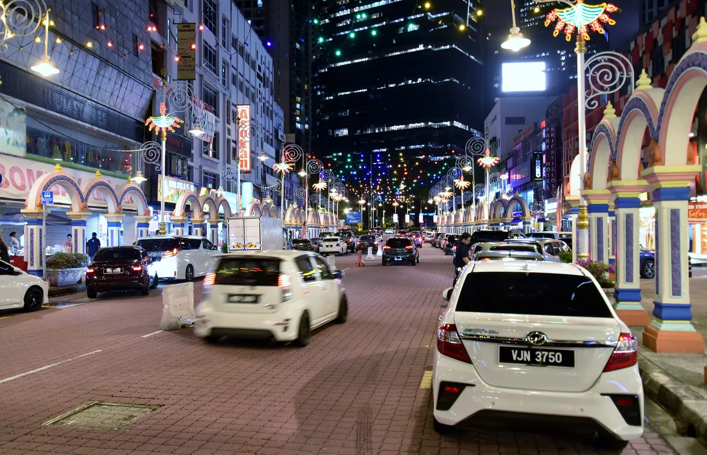 Shophouses and street life in Brickfields, Kuala Lumpur, at night
