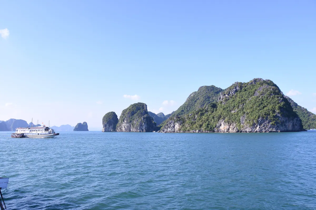 Traditional junk boats among the limestone karsts of Ha Long Bay