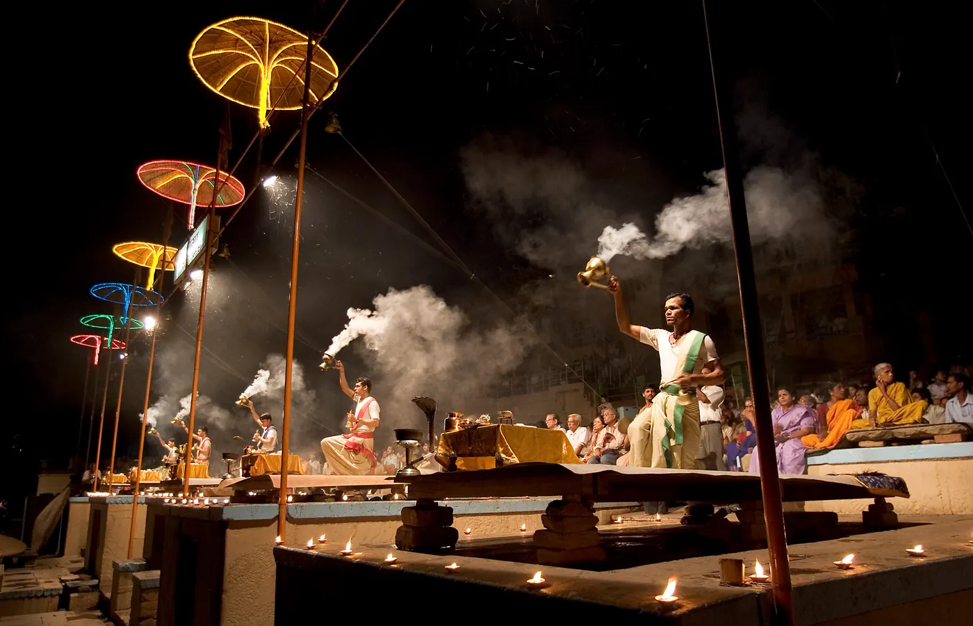 Priests performing the evening Ganga Aarti ceremony on a ghat at Varanasi